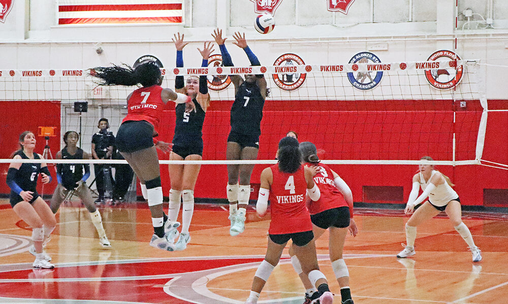 Clemson commit Ihuoma Ozoh (7) sets up for a kill as the Vikings gain momentum during the first set. Despite the surge, the Vikings fell later in the match. (Benjamin Faoro/HF Chronicle)