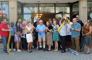 The Van Sipma family officially marks 125 years in business with a ribbon-cutting alongside Homewood Mayor Rich Hofeld (center) on Saturday, Oct. 4. (Nuha Abdessalam/H-F Chronicle)