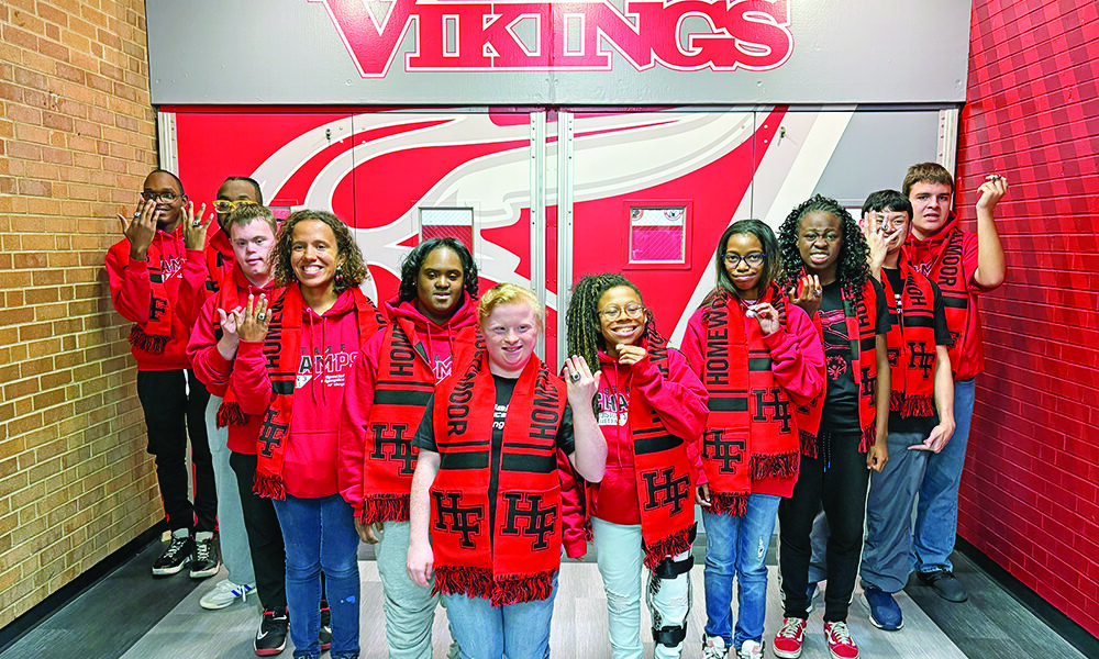 Members of the Homewood-Flossmoor High School Red & White team show off their championship rings presented Oct. 21 marking the team's first place win in Division 3 Special Olympics state basketball tournament. Coach Brian Garland said the team made the H-F community "overwhelmingly proud." (Provided photo)