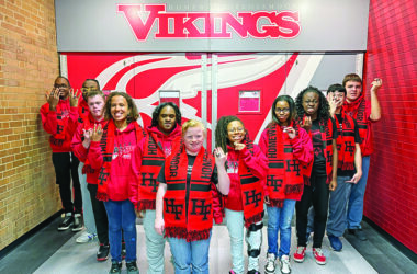 Members of the Homewood-Flossmoor High School Red & White team show off their championship rings presented Oct. 21 marking the team's first place win in Division 3 Special Olympics state basketball tournament. Coach Brian Garland said the team made the H-F community "overwhelmingly proud." (Provided photo)