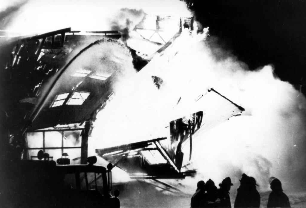 Firefighters stand helpless to douse the flames that consumed Washington Park’s clubhouse and other structures the night of Feb. 5, 1977. (Provided photo/Homewood Historical Society)