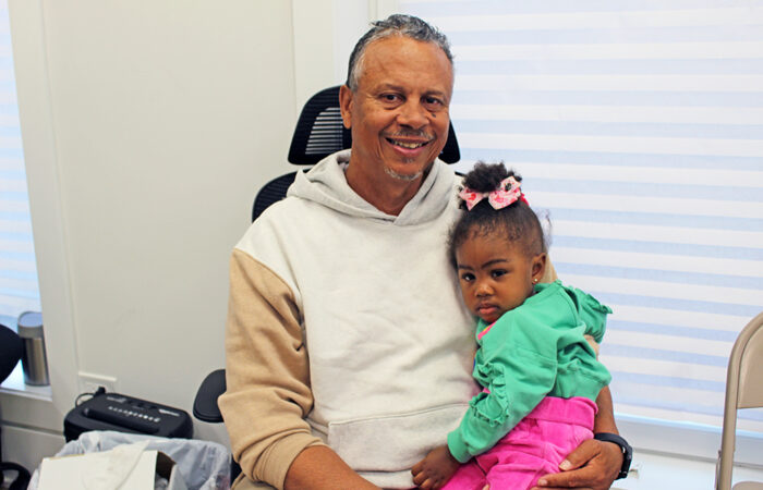 Cousins open DRYmedic of Homewood#8_web Lance Jones Sr. spends a moment with his granddaughter Jream during the DRYmedic of Homewood grand opening. (Nuha Abdessalam/H-F Chronicle)