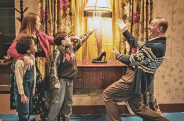 Members of "A Christmas Story" case act out the scene where The Old Man shows off his major award. In the scene, the mother is played by Crystal Phillips-Pierce, with son Randy performed by Aegis Rah'man, and Ralphie by Everett Johnson. The Old Man is played by Bob Bullen. (Provided photo/Stacey Froeschle)