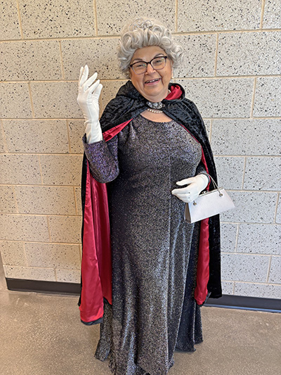 The queen gives her subjects a wave. Mary Novak of Homewood took the top prize in the Halloween costume contest at the Seniors Breakfast. (Marilyn Thomas/H-F Chronicle)