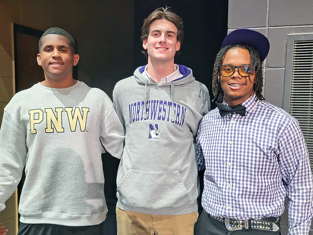Homewood-Flossmoor baseball seniors (from left) Antonio Brown Jr., Henry Humes and Jhames Holley signed their college letters of intent in a ceremony in the school's auditorium Wednesday. (David P. Funk/H-F Chronicle)