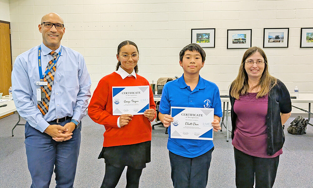From left, Superintendent Dana Smith with orchestra students Ameya Thigpen and Elliot Chan, and Parker Band Director Elana Reid. (Chris Weber/H-F Chronicle) New boost