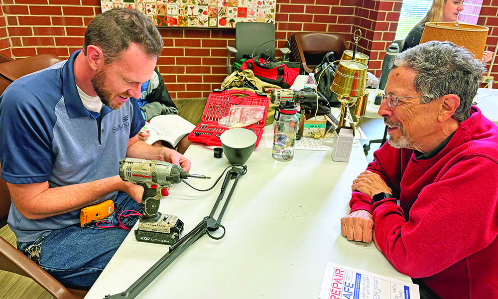 Homewood-Flossmoor High School teacher Bill Merchantz, left, was able to repair two lamps for Flossmoor resident Dave Carvalho. (Marilyn Thomas/H-F Chronicle)
