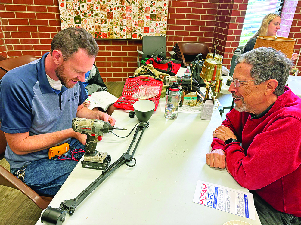 Homewood-Flossmoor High School teacher Bill Merchantz, left, was able to repair two lamps for Flossmoor resident Dave Carvalho. (Marilyn Thomas/H-F Chronicle)