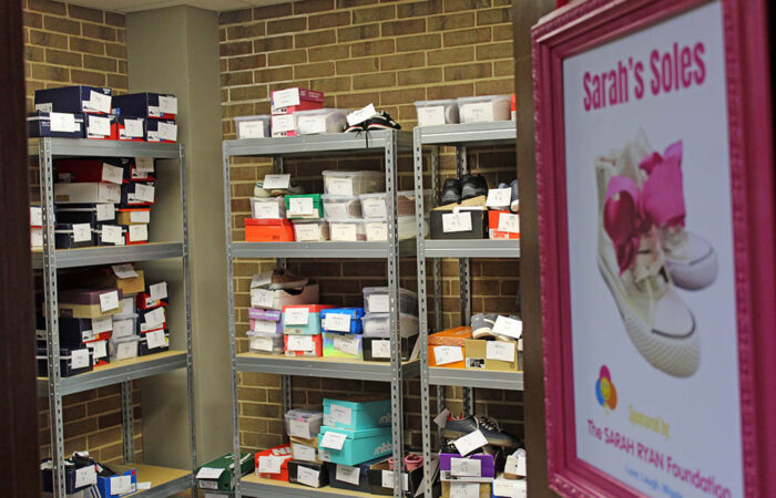 Shelves inside Sarah’s Soles hold new shoes for children and adults. Staff say kids’ sizes and men’s shoes are picked up the fastest. (Nuha Abdessalam/H-F Chronicle)