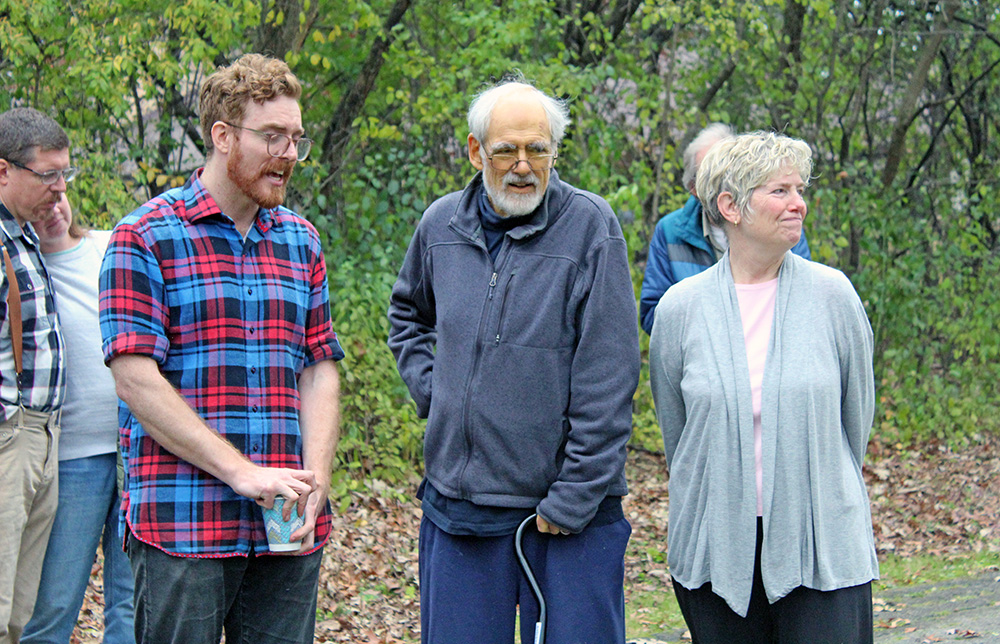 Emmett Houlihan speaks to the group as Tom and Patty Houlihan stand with him during the ceremony. (Nuha Abdessalam/H-F Chronicle)