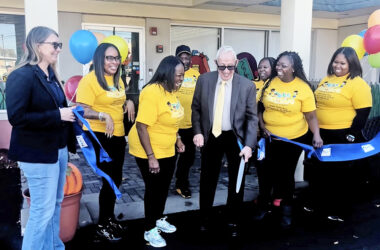 Homewood Mayor Rich Hofeld cuts the blue ribbon with Tots to Scholars ownership and staff. (Nick Ulanowski/ H-F Chronicle)
