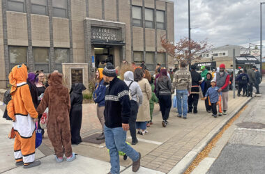 Trick-or-treaters lining up in front of the Homewood Fire station. (Nick Ulanowski / H-F Chronicle)