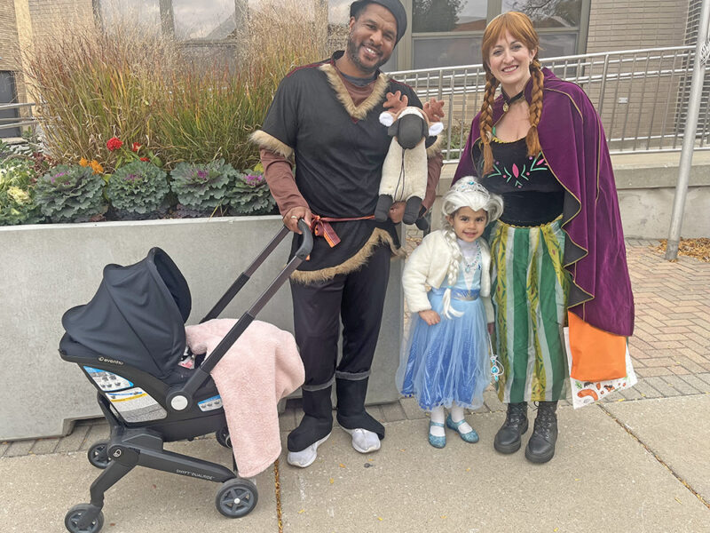 The Stokes family go trick or treating in Homewood dressed like characters from the Disney movie, Frozen. (Nick Ulanowski / H-F Chronicle)