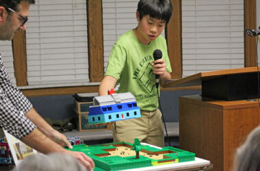 Elliott Chan explains the team’s LEGO model of the Horton Site, based on original maps and excavation notes from the 1960s dig. (Nuha Abdessalam/H-F Chronicle)