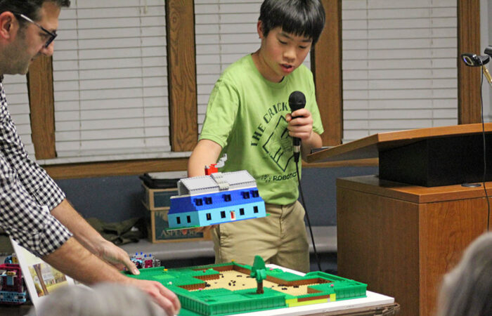 Elliott Chan explains the team’s LEGO model of the Horton Site, based on original maps and excavation notes from the 1960s dig. (Nuha Abdessalam/H-F Chronicle)