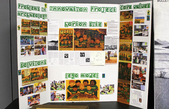 The Cricketeers’ trifold display highlights their research, outreach and LEGO recreation of the Horton Site. (Nuha Abdessalam/H-F Chronicle)
