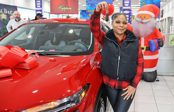 Christmas Eve- Chevy#11_web Lameisha Moon holds up the keys to her new 2026 Chevrolet Trax after being selected as this year’s Homewood Chevy Cares Car Giveaway winner. (Nuha Abdessalam/H-F Chronicle)