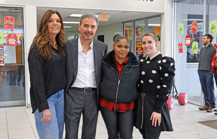 Christmas Eve- Chevy#9_web Lameisha Moon poses with dealership staff, from left, Gina Morin, owner Steve Phillipos and, far right, Sarah Lovitt. (Nuha Abdessalam/H-F Chronicle)