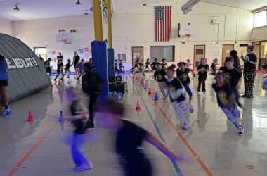 The Willow School gym became a running course as students ran around in the Glow Run fundraiser Friday, Nov. 21. (Marilyn Thomas/H-F Chronicle)