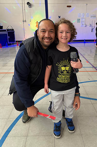 Parent volunteer Aredell Roundtree with his daughter Lennon, a first grader at Willow School. All students got the specially designed T-shirt thanks to business sponsors. (Provided photo)