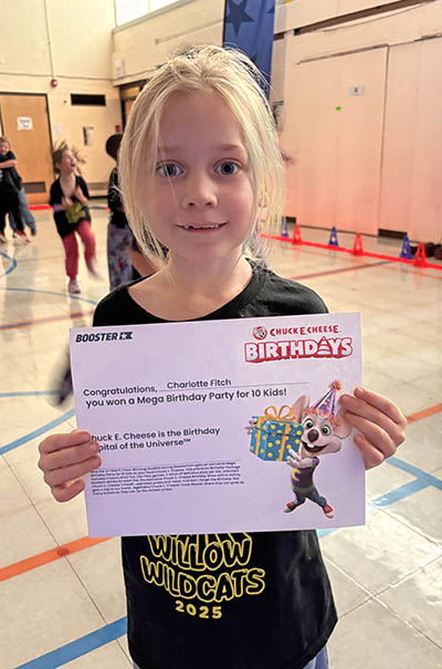 Willow School second grader Charlotte Fitch won a mega birthday party prize to Chuck E. Cheese at the Glow Run fundraiser. (Provided photo)