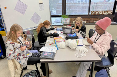 Members of the Parker Junior High Knitting and Crochet Club work on projects together. (Provided photo)