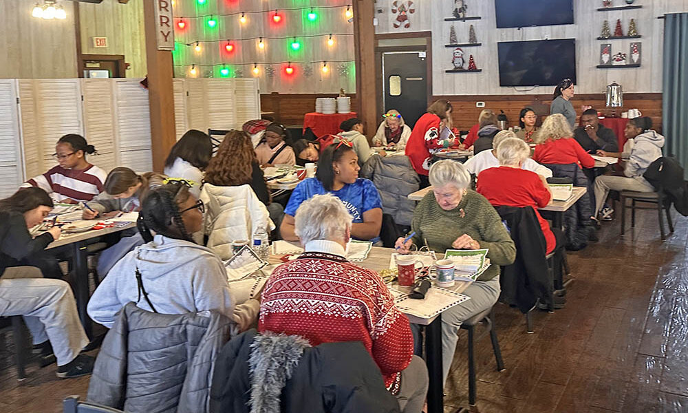 Homewood-Flossmoor High School seniors and volunteer elders join forces for the annual Santa's Senior Helpers project sponsored by the H-F Park District and the villages of Homewood and Flossmoor. (Jon Bannister/H-F Chronicle)
