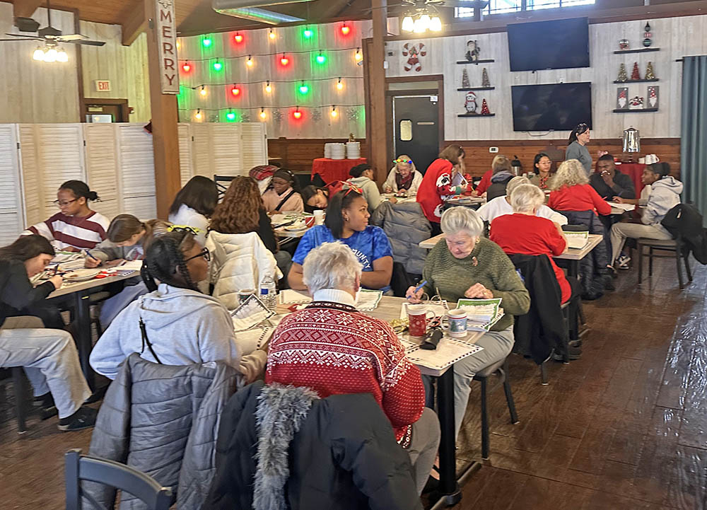 Homewood-Flossmoor High School seniors and volunteer elders join forces for the annual Santa's Senior Helpers project sponsored by the H-F Park District and the villages of Homewood and Flossmoor. (Jon Bannister/H-F Chronicle)
