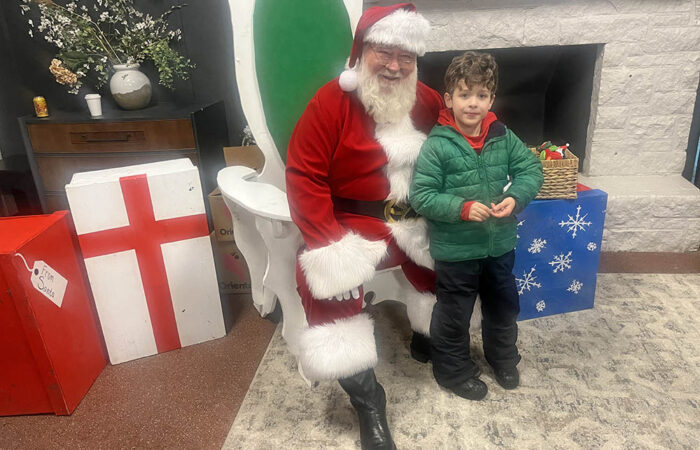 Griffin Wiegand, a 5-year-old Flossmoor resident, visits with Santa during the Flossmoor holiday celebration on Nov. 29. (Nick Ulanowski / H-F Chronicle)
