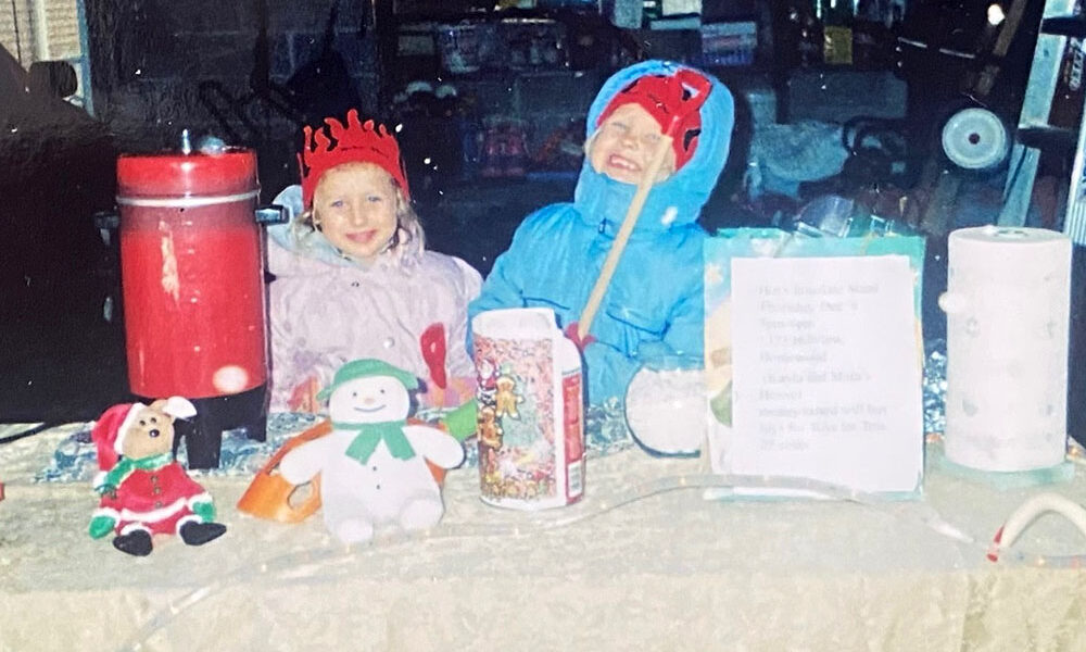 Mara and Kayla Winfrey at ages 2 and 4 during their very first hot chocolate stand, a small front-yard setup that grew into a 22-year Toys for Tots tradition. (Provided photo)