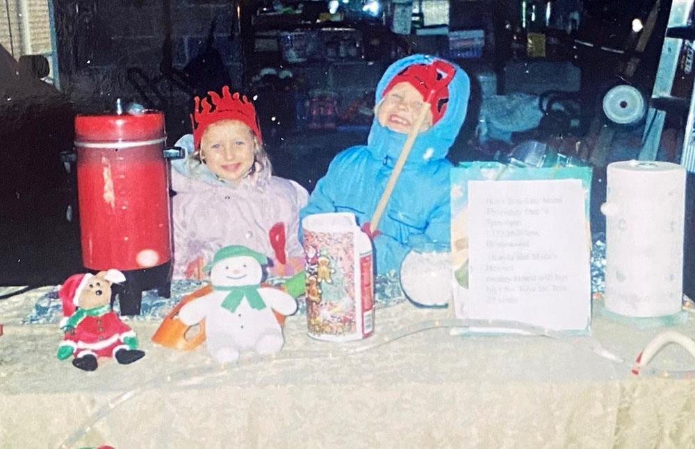 Mara and Kayla Winfrey at ages 2 and 4 during their very first hot chocolate stand, a small front-yard setup that grew into a 22-year Toys for Tots tradition. (Provided photo)