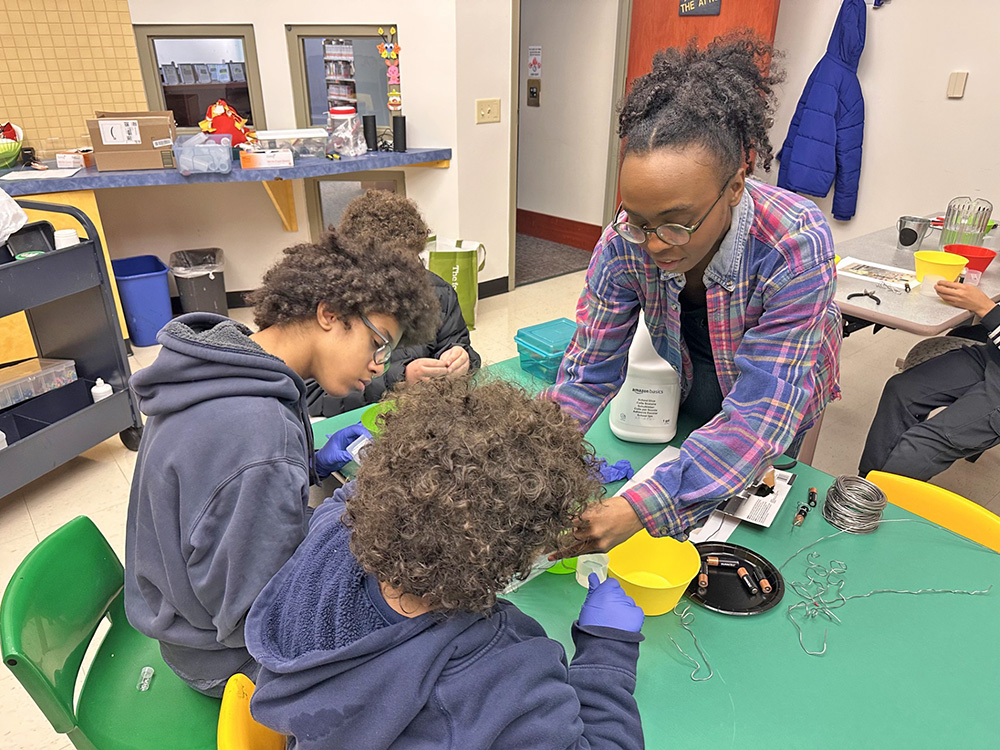 Krystal web helping children make slime during the hands-on Winter Science program at Flossmoor Public Library. (Jon Bannister/H-F Chronicle)
