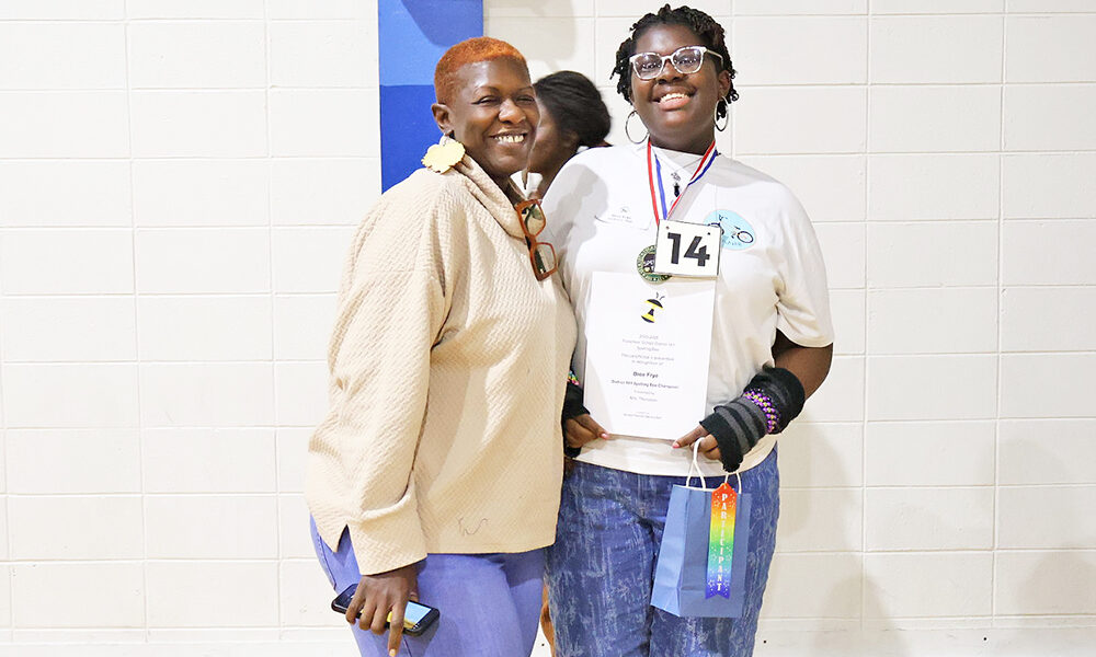 Bree Frye, right, poses with her mom, La Frye, after winning the District 161 spelling bee. One proud moment, times two. (Nuha Abdessalam/H-F Chronicle)
