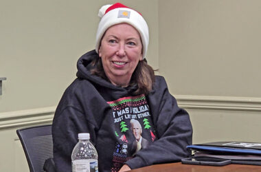 Homewood Police Chief dons a Santa hat at the Dec. 9, 2025, village board meeting, the last of the year, where staff wear holiday sweaters and other festive gear. At the end of the meeting, Mayor Rich Hofeld announced McGrath's plan to retire Jan. 9. (Eric Crump/H-F Chronicle)