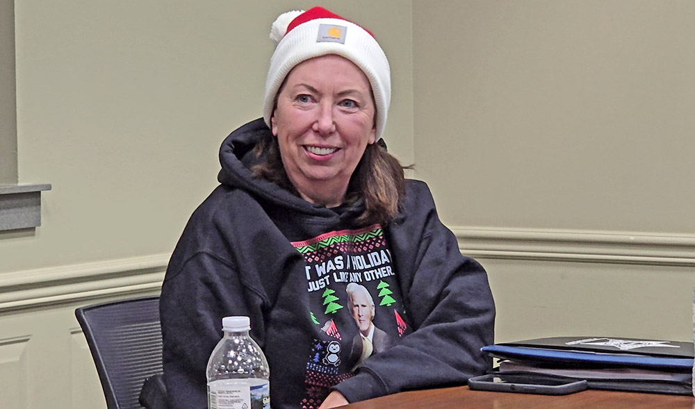 Homewood Police Chief dons a Santa hat at the Dec. 9, 2025, village board meeting, the last of the year, where staff wear holiday sweaters and other festive gear. At the end of the meeting, Mayor Rich Hofeld announced McGrath's plan to retire Jan. 9. (Eric Crump/H-F Chronicle)