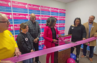 Donna Miller, center, cuts the ribbon to open her campaign headquarters in Flossmoor on Sunday, Jan. 11. Miller is running in the March primary election to represent the Democratic Party Illinois' 2nd District in November. (Eric Crump/H-F Chronicle)