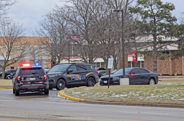 Police vehicles are stationed at Homewood-Flossmoor High School on Friday afternoon, Jan. 16, after a gun was found in the South Building. (Eric Crump/H-F Chronicle)