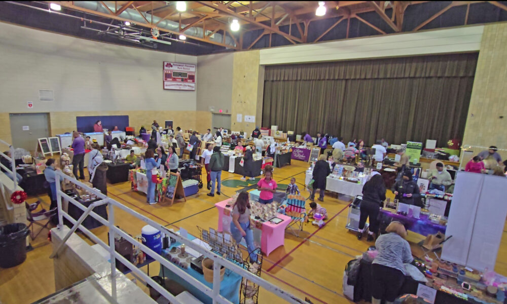 Patrons and vendors mingle during the Homewood Holiday Market in December. The auditorium will host the Indoor Farmers Market the last Saturday of each month starting Saturday and going through the end of April. (Eric Crump/H-F Chronicle)