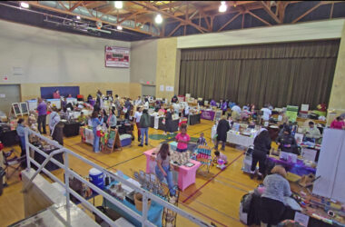 Patrons and vendors mingle during the Homewood Holiday Market in December. The auditorium will host the Indoor Farmers Market the last Saturday of each month starting Saturday and going through the end of April. (Eric Crump/H-F Chronicle)