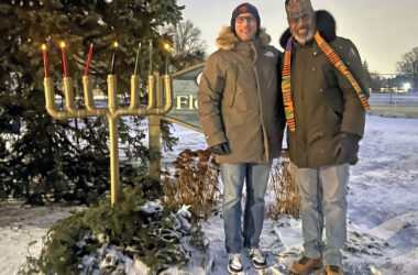 Flossmoor School District 161 Superintendent Dana Smith, left, and Flossmoor School District 161 school board President David Linnear after lighting the Kinara on Dec. 29, the fourth day of Kwanzaa. (Nick Ulanowski / H-F Chronicle)