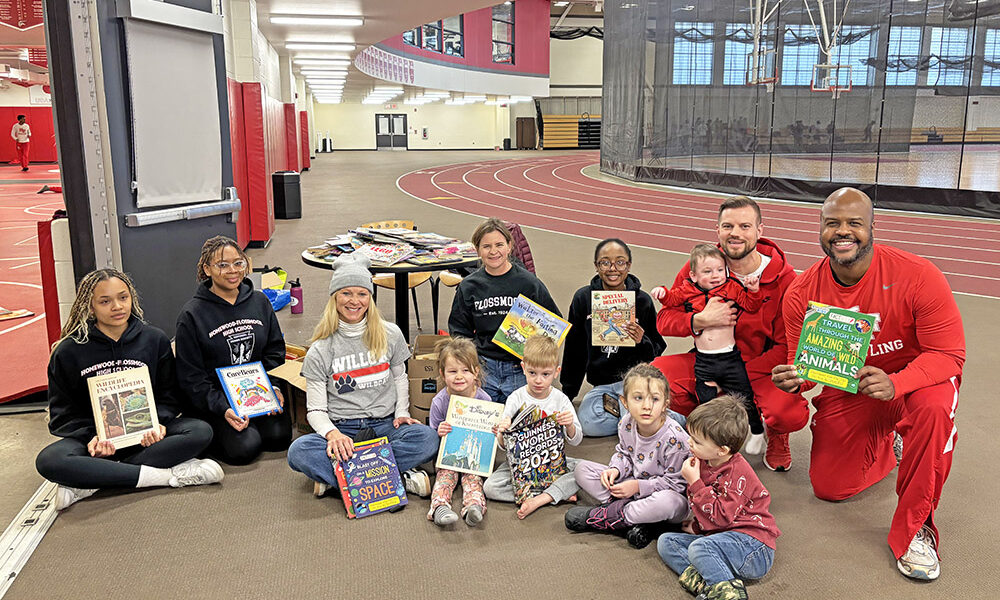 A group of volunteers, gathered for the Martin Luther King Jr. Day of Service at Homewood-Flossmoor High School on Monday. Members of the wrestling team read to young children as their Day of Service project. (Marilyn Thomas/H-F Chronicle)