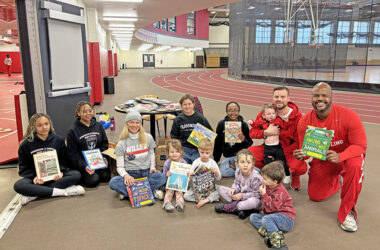 A group of volunteers, gathered for the Martin Luther King Jr. Day of Service at Homewood-Flossmoor High School on Monday. Members of the wrestling team read to young children as their Day of Service project. (Marilyn Thomas/H-F Chronicle)