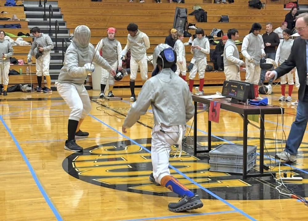 Marian Catholic fencer Logan Liguras competes against an opponent from Libertyville/Vernon Hills (Provided Photo)