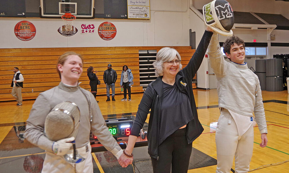 From left, Nikolai Lawrence of H-F High, Marian Head Fencing Coach Ann Jones, and Marian senior Elijah Wagner after the "Family Feud Match" on Jan. 17. (Provided Photo).