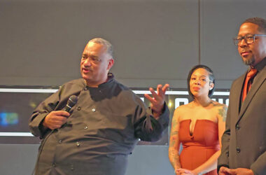 Chef David Mitchell, left, speaks to guests at the ribbon cutting event for Mitchell & Michaels Plat du Jour while partner Chris Michaels, right, and his wife, Stacey Pegue, listen. (Eric Crump/H-F Chronicle)
