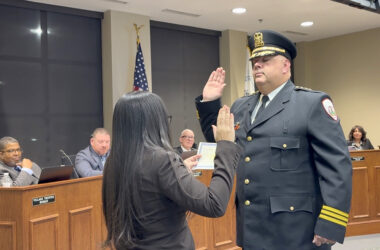 Thomas Johnson taking the oath of office for his new position as Homewood chief of police at the Jan. 27 village board meeting. (Summer Kiswani/ H-F Chronicle)
