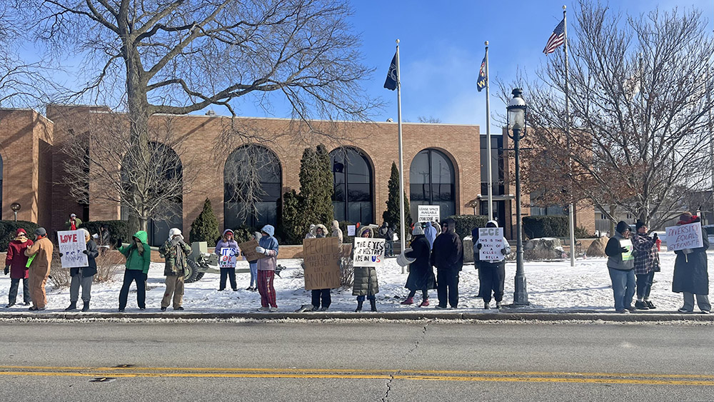 Community demonstrators rally in front of the Homewood Veterans Memorial on Martin Luther King Day, protesting the actions of the Trump administration and U.S. Immigration and Customs Enforcement (ICE). (Nick Ulanowski / H-F Chronicle)
