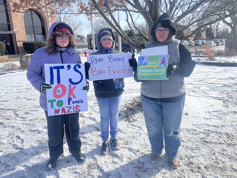 Katherine Herrman, right, protesting with her kids at the We Have a DREAM rally on Jan. 19 in Homewood. (Nick Ulanowski / H-F Chronicle)