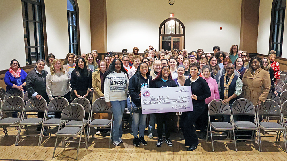 Members of 100+ Women Who Care – South Suburbs present a check to Destiny Watson of You Matter 2. (Nuha Abdessalam/H-F Chronicle)