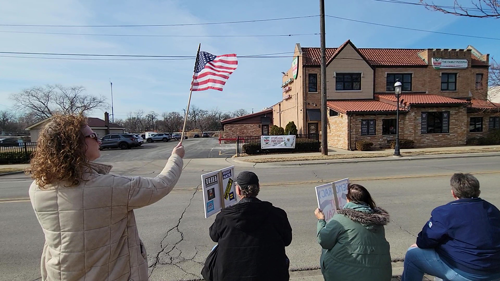 A number of participants in the ABT Presidents Day rally on Feb. 16 waved U.S. flags. (Eric Crump/H-F Chronicle)